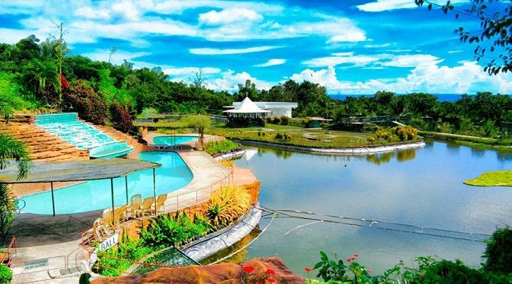 Scenic view of Garin Farm and Pilgrimage in Iloilo, showcasing lush landscapes and religious monuments in a serene environment.