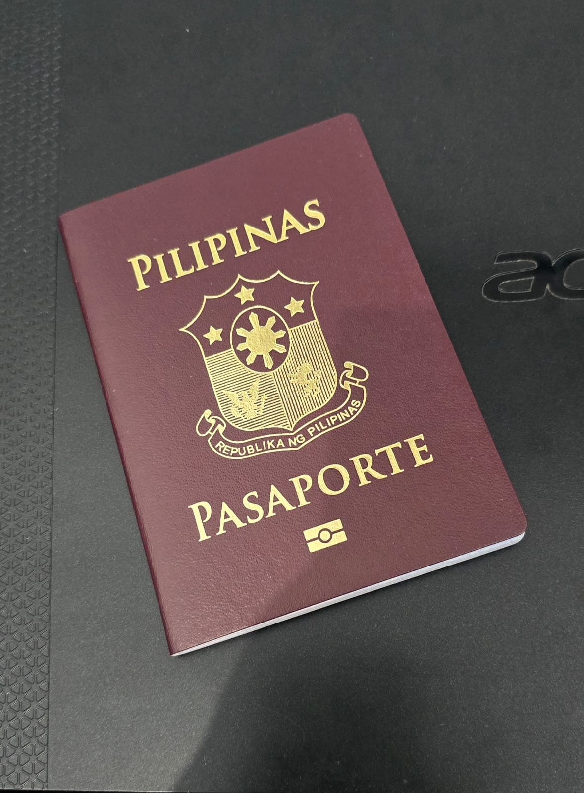 Close-up image of a Philippine passport with a scenic background, ideal for travel and identification purposes